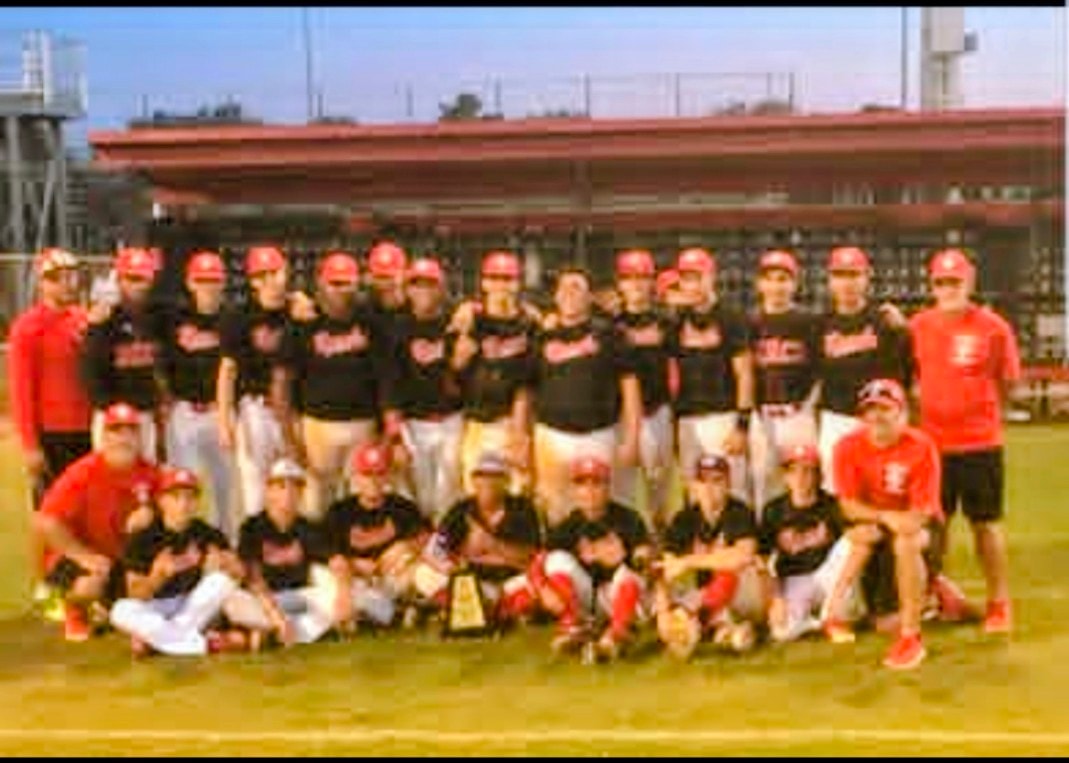 Miami Beach Senior High School Varsity Baseball Team celebrating their District Championship with Coach Juan Cordero.